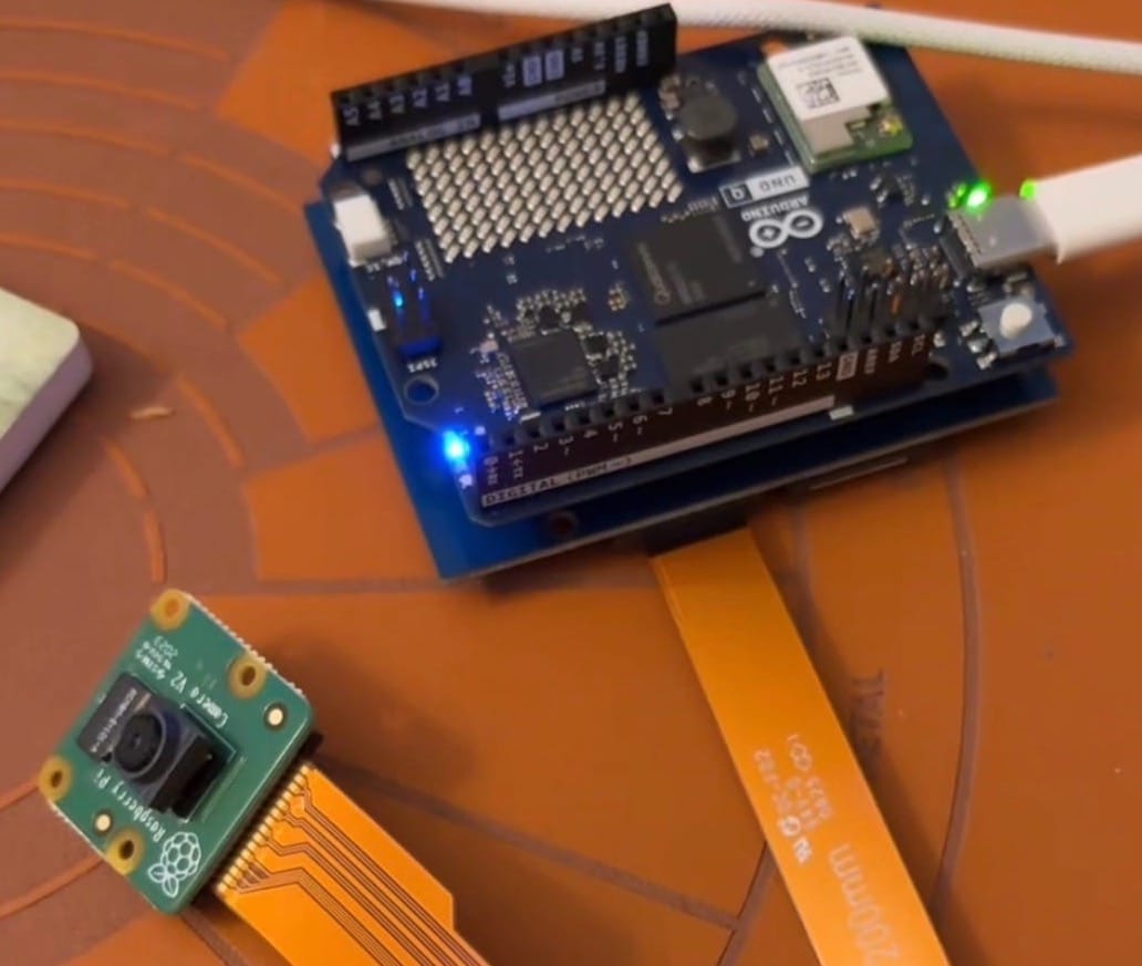 Arduino UNO Q with Camera Breakout Module / Board that is connected to a Raspberry Pi V2 camera.